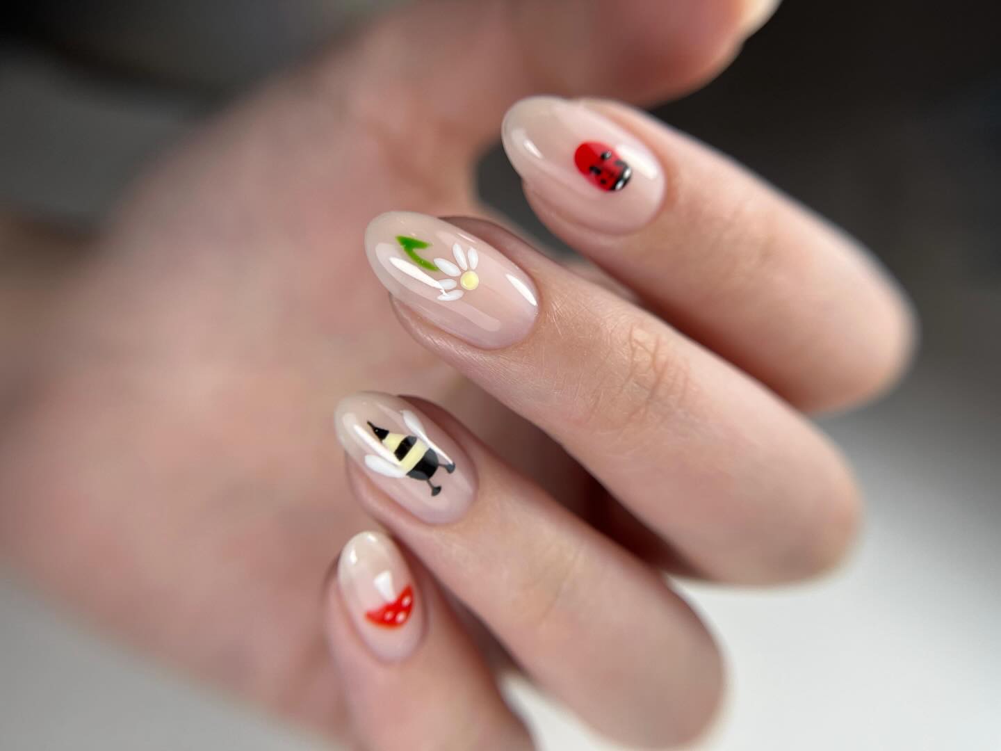 Luxurious salon interior with blush seating and cascading fringe accents.