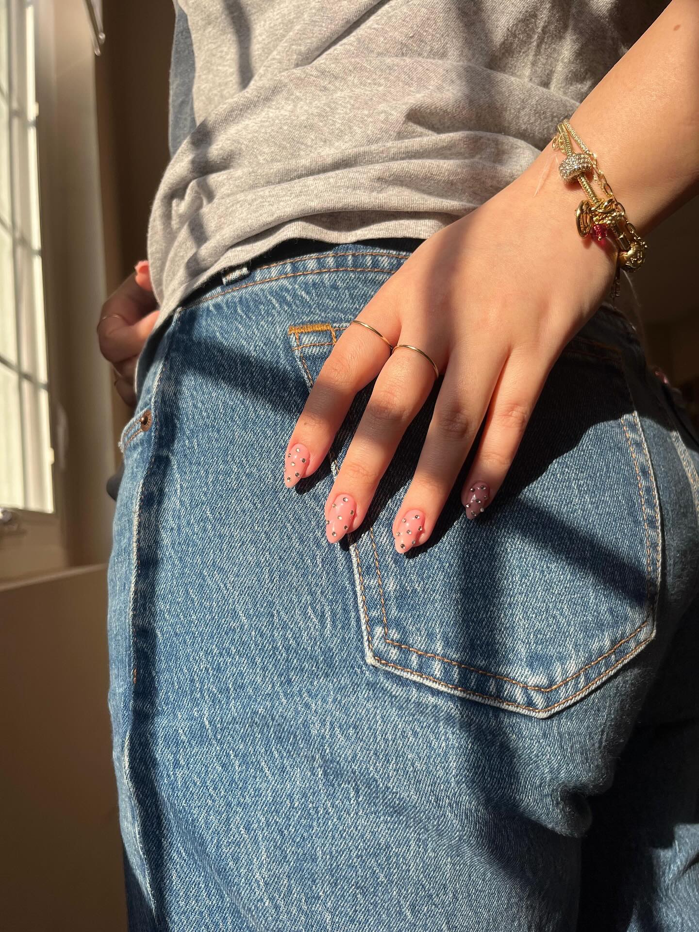 Gilded hair waves styled with velvet ribbon accessory.